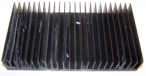 Used Aluminum Heatsink 1.25&#034; H x 4&#034; W x 7.25&#034; L Black in color with holes