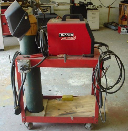 Lincoln Arc Welder, Model SP-130T with rolling cart, mask and gas cylinder