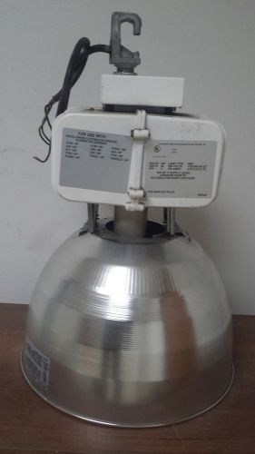 Light fixture retrofitted with a 100 watt 120-277 volt led self ballasted lamp for sale