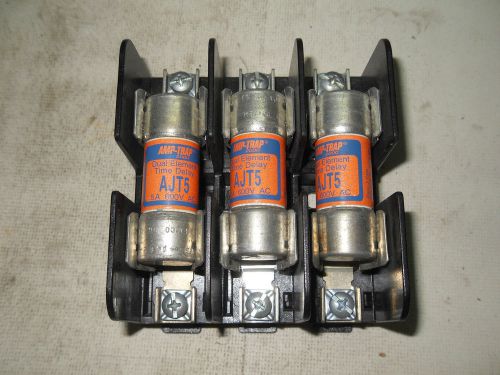 (h3) 1 used gould shawmut 60328sj fuse block w/ 3 used amp-trap ajt5 fuses for sale