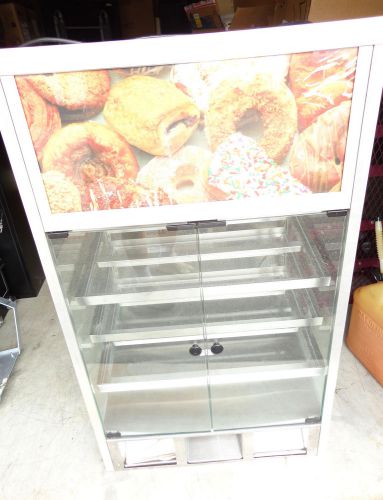 Bakery display case donuts cookies baked goods for sale