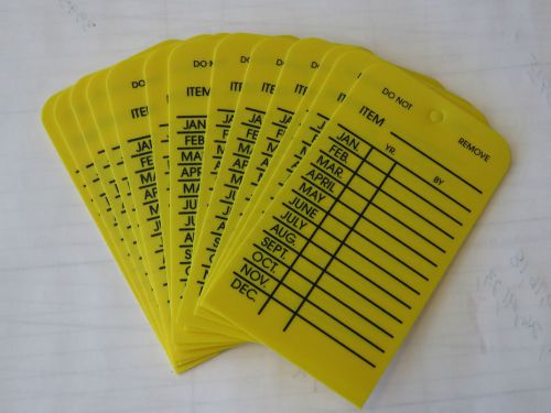 50-H.D. PLASTIC MONTHLY INSPECTION TAGS HIGH-DENSITY YELLOW INDOOR/OUTDOOR USE