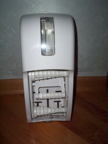Tork bath tissue roll dispenser white color t26 new in the box with key 209303a for sale