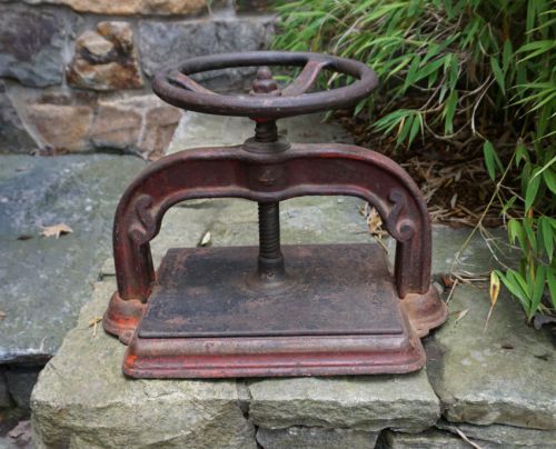 Antique cast iron book press with original red paint c1880