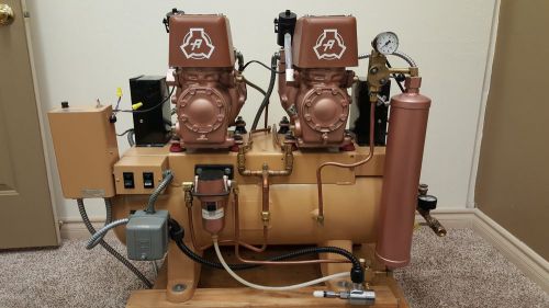 Air Techniques  twin oil type Dental air compressor with desiccant dryer