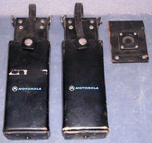 Two Motorola radio holsters, one belt mount