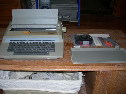 Sharp QL 800 electric typewriter w/ extra ribbon and instructions