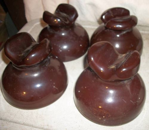 Four (4) insulators porcelain saddleback 5&#034; x 4&#034; dark brown stamped sbt new for sale