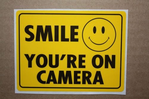 This is a &#034;smile you are on camera sticker&#034; buy 1 get 1 free!!!