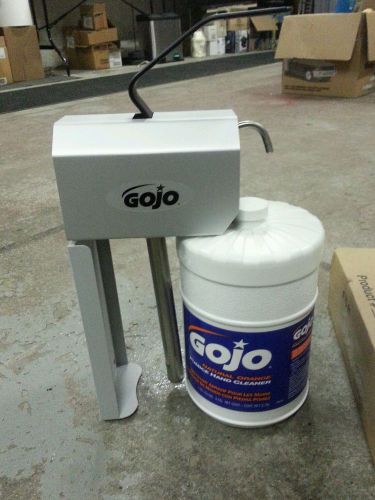 Gojo dispenser 1279-01 plus a gallon of 0956 natural orange pumice hand cleaner for sale