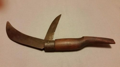 ANTIQUE AUSTRIA HAWKBILL SERRATED KNIFE WITH STRAIGHT LINE BLADE.