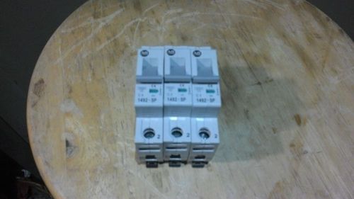 lot of three allen bradley series c circuit breakers 2,3, and 5 amp loads