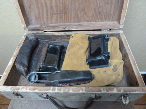 Vintage leather welding hoods in box with striker and leather holder