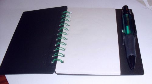 Black plastic spiral bound notepad with built in pen holder and ball-point pen