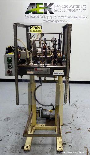 Used- Thiele Engineering Model 34-000 Rotary Coupon Placer. Has magazine and int