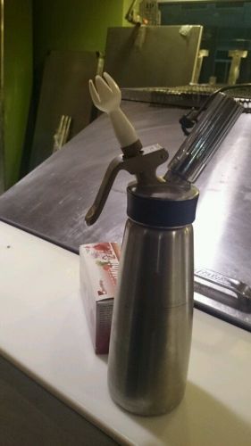 Used whipped cream dispenser with free case of chargers