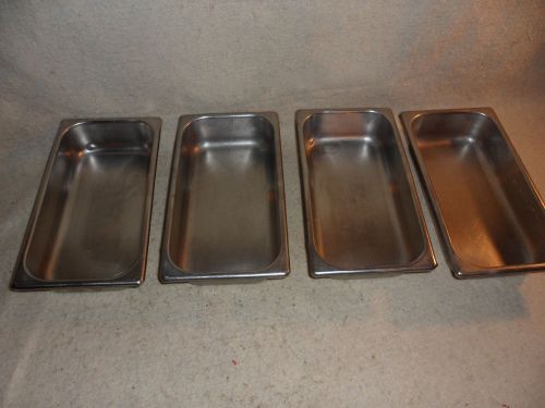 four stainlees steel steam table pans