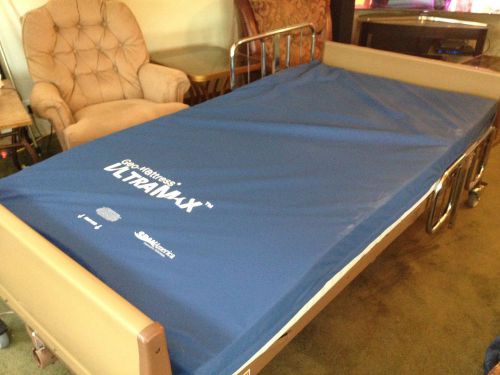 Invacare electric hospital bed BAR6640IVC with padded mattress and gel overlay