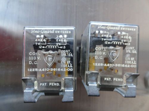 a pair of vintage Uni-Guard switches 1220-A410-361342-00