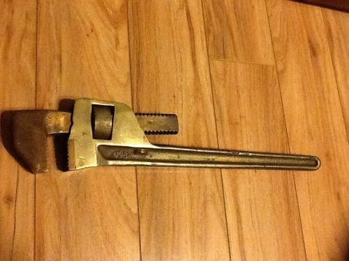 An Amplo brass pipe wrench.
