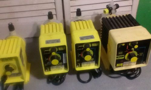 Lot of 4 lmi milton roy chemical metering pumps for sale