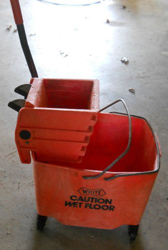 Used orange rubbermaid 8 gallon mop bucket with ringer for sale