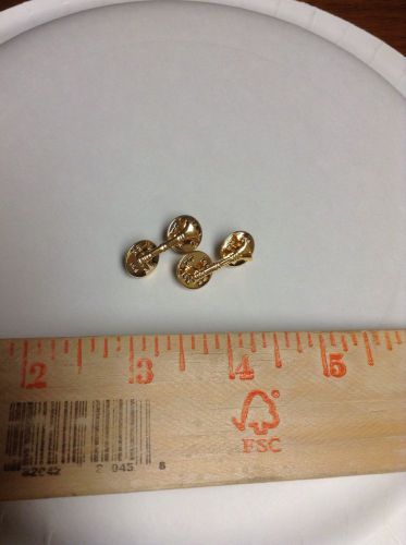 Gold bugle pins