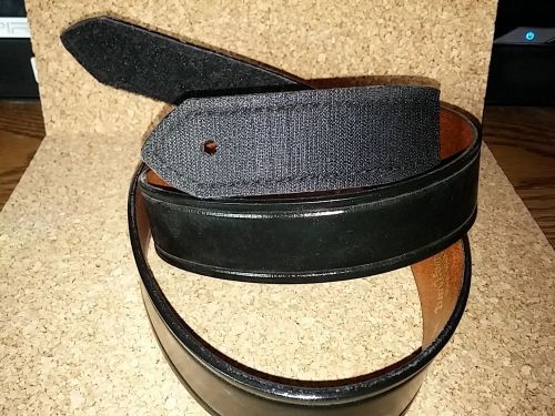 Black Don Hume leather belt with velcro fastener.