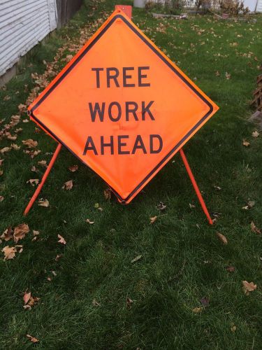 Tree work ahead sign with economy stand for sale