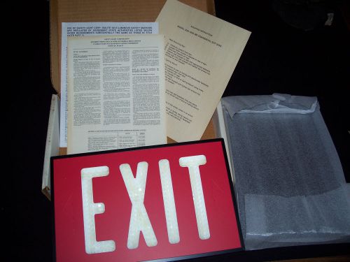 Isolite Self Luminous Exit Sign 2040 Black Metal frame New Old Stock Date 7-91