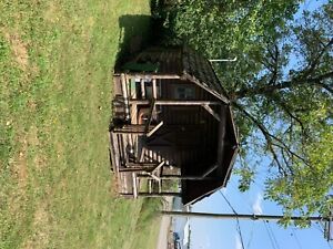 12x12 wooden log cabin storage buildings sheds, one bedroom, two side windows