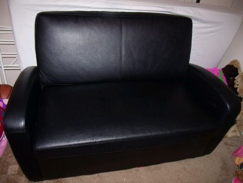 Black Leather Love seat with hide-a-bed