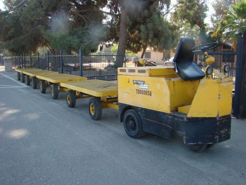 Pettibone mercury warehouse tug with 8 trailers, battery charger for sale