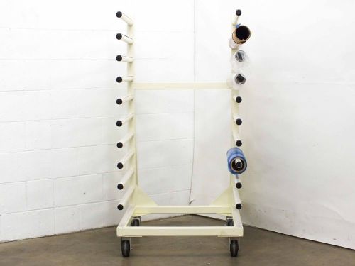 Generic large white roller rack with assorted rolls for sale