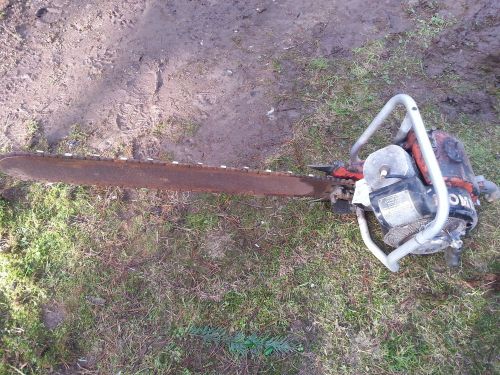 This is an antique homelite chain saw for sale