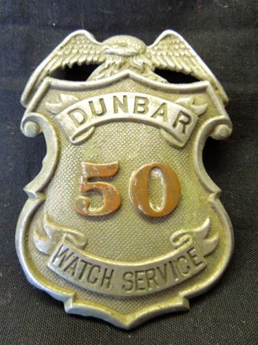 VINTAGE EMBOSSED #50 DUNBAR WATCH SERVICE OFFICERS BADGE