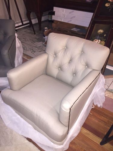 Safavieh tufted very durable cloth club chair with 4 brass casters on legs BN