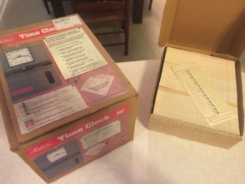 Lathem time clock model 2121 and box of time cards for sale