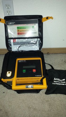 Physio-control lifepak 500 with hard shell case and new oem battery for sale