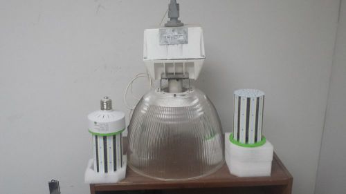 Light fixture retrofitted with a  100 watt 120-277 volt led self ballasted lamp for sale
