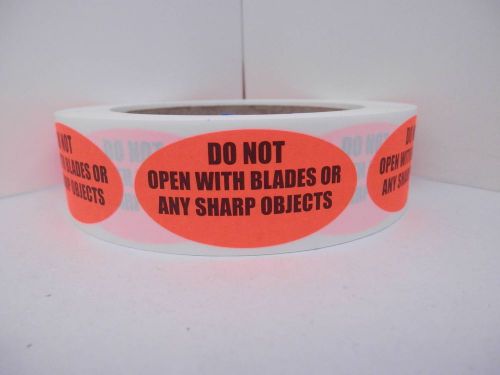 DO NOT OPEN WITH BLADES OR ANY SHARP OBJECTS fluor red 1X2 Oval Label 250/rl