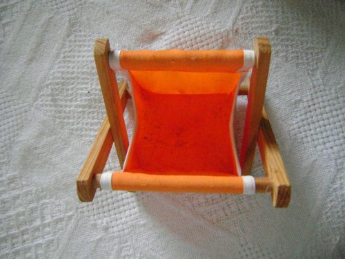 very cute little wood orange laundr basket on deck for all your little things
