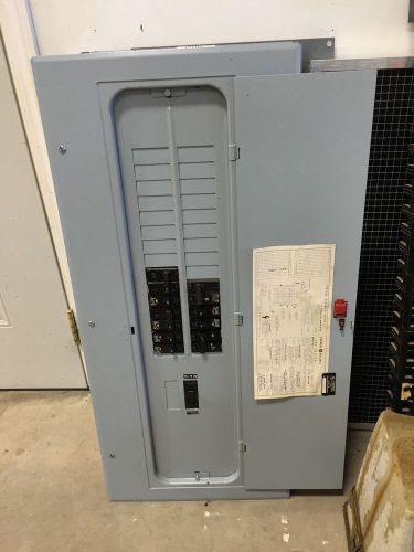 G E 125 A 30 circuit breaker panel with some breakers and main breaker