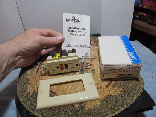 Preowned unused Leviton ivory 15A-125V Receptacle/Outlet w/box.