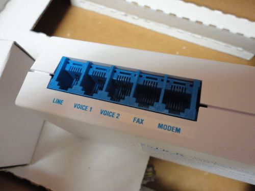 The Stick - Programmable voice/fax/modem call processor line sharing switch