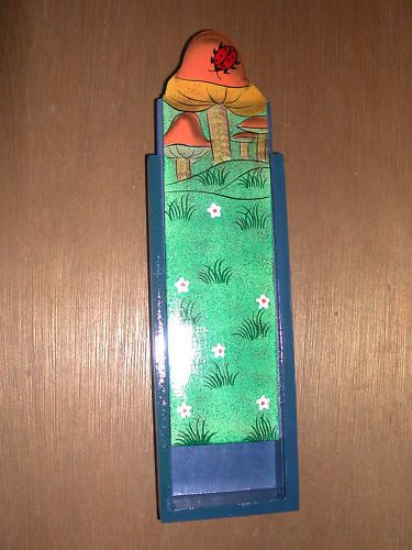 Wooden pencil box painted colorfully with mushrooms
