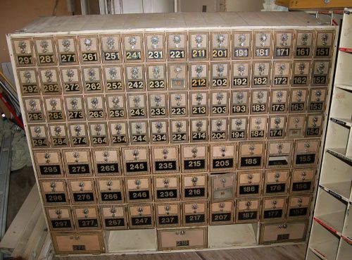 Four wall units of antique post office boxes (376 po box faces) for sale