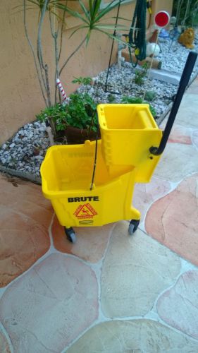 Rubbermaid  commercial rolling bucket  brute with mop for sale