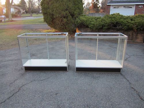 Two 48&#034; wide Glass Display Cases.  Glass tops, shelves, Mirrored doors, lights.