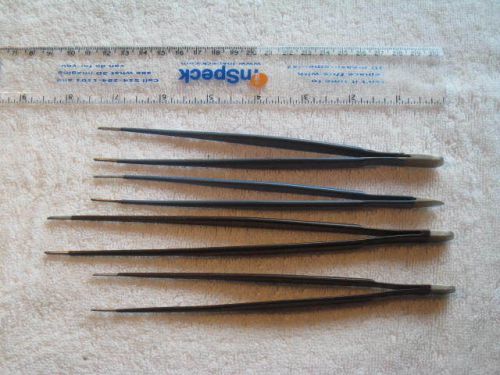 Two pairs of insulated surgical tissue forceps--O.R. grade.